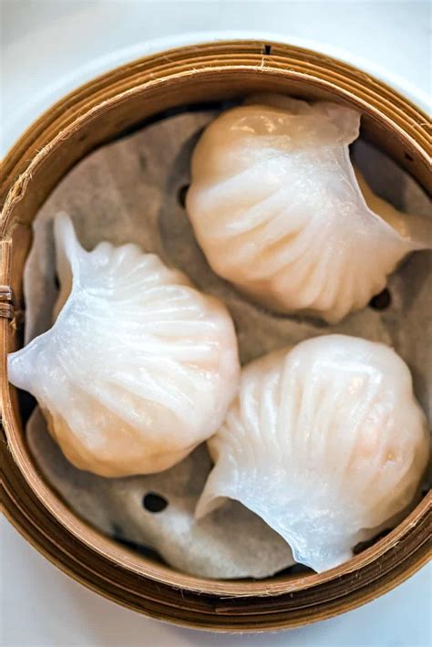 Learn how to make Har Gow, a classic Cantonese dish of translucent shrimp dumplings with juicy filling and crispy skin. Follow the detailed recipe with tips and tricks for perfect dough, filling and folding.